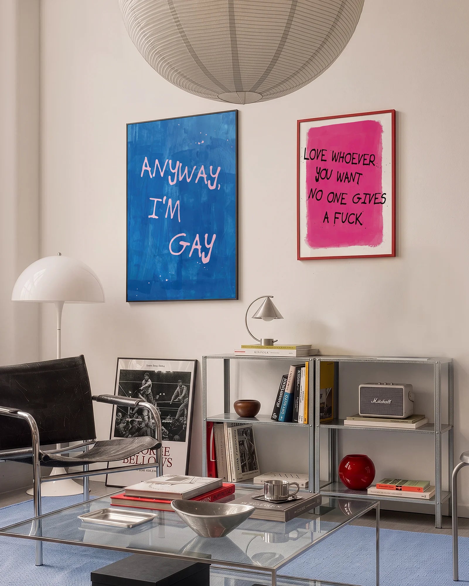 A poster with the text 'ANYWAY, I'M GAY' in pink, against a blue abstract background.