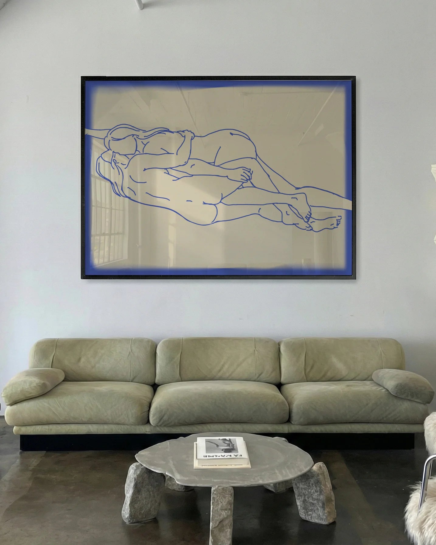 The poster shows two naked women in line art, lying down horizontally, holding each other.
