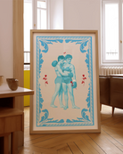 A poster that depicts two queer, muscular boxers in a romantic embrace, surrounded by red roses and a blue frame.