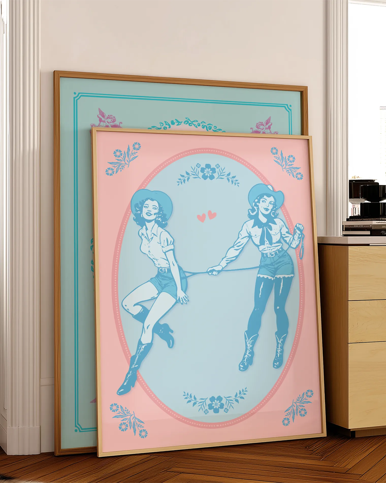 A poster with two illustrated cowgirls, catching each other with a lasso.