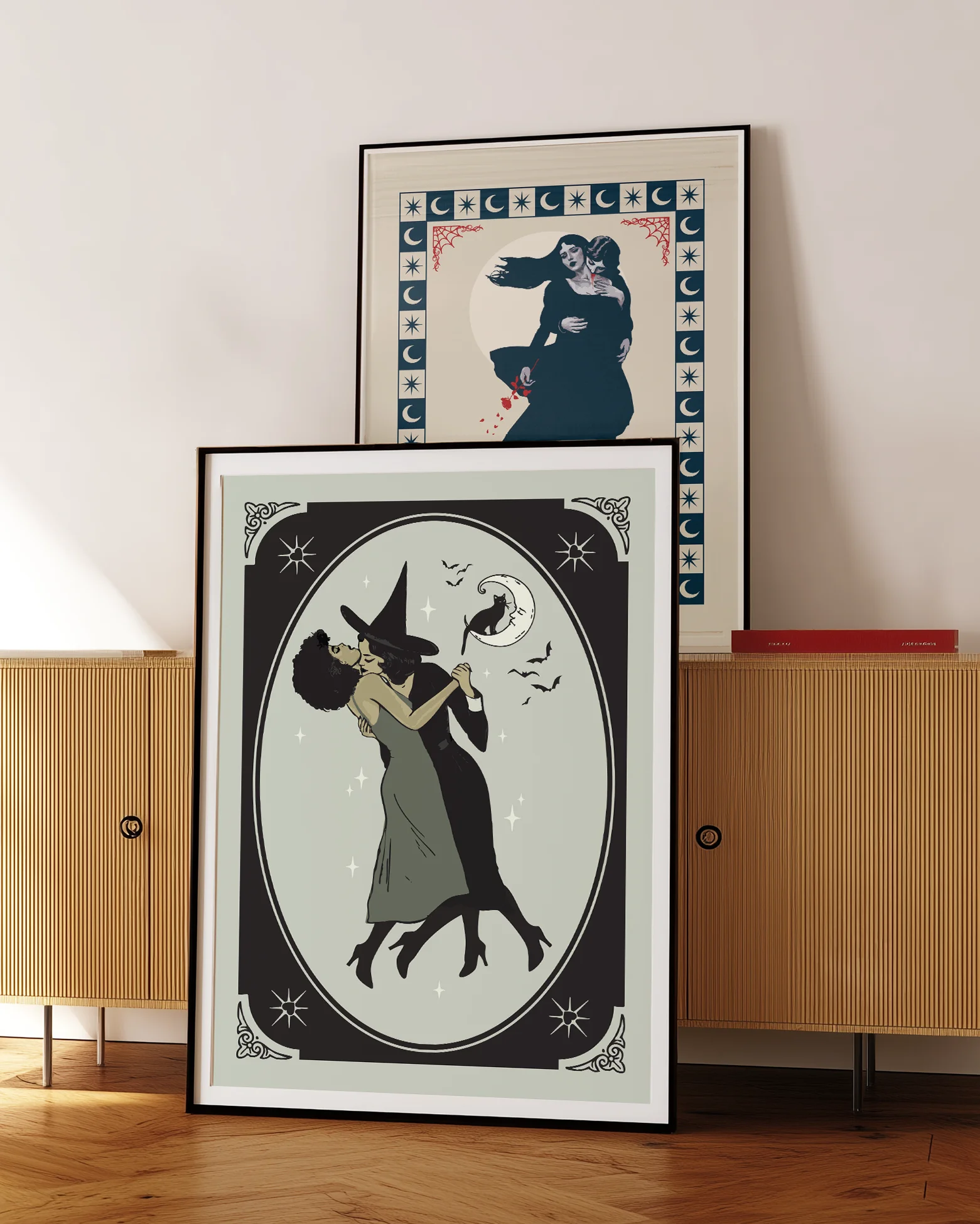 A poster with a lesbian witch couple kissing.