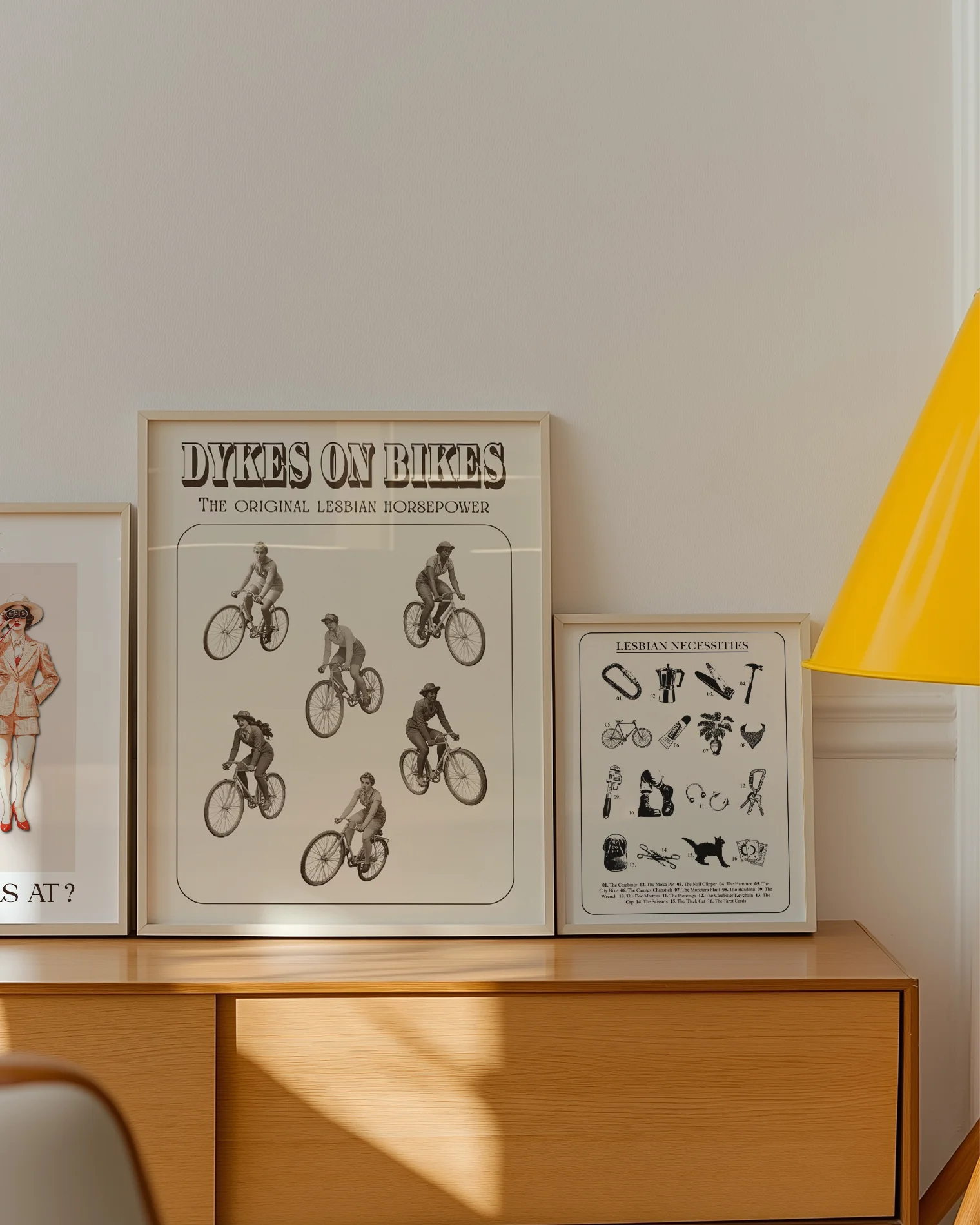 A poster featuring six lesbian women riding bicycles in a 1940s style, with the text: “DYKES ON BIKES” and “THE ORIGINAL LESBIAN HORSEPOWER.”