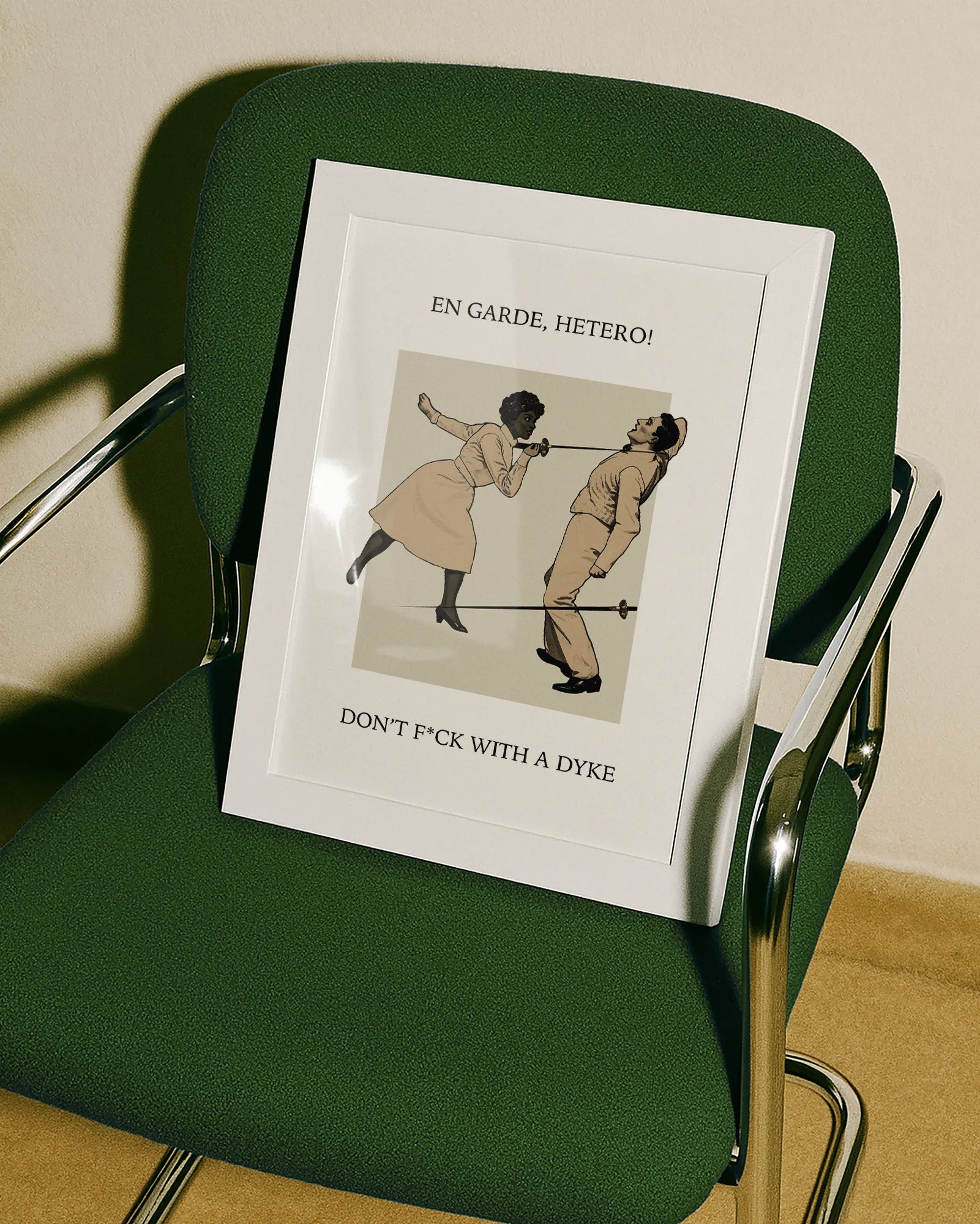 A poster with a woman fencing a man, with the text: "EN GARDE, HETERO! DON'T FUCK WITH A DYKE."