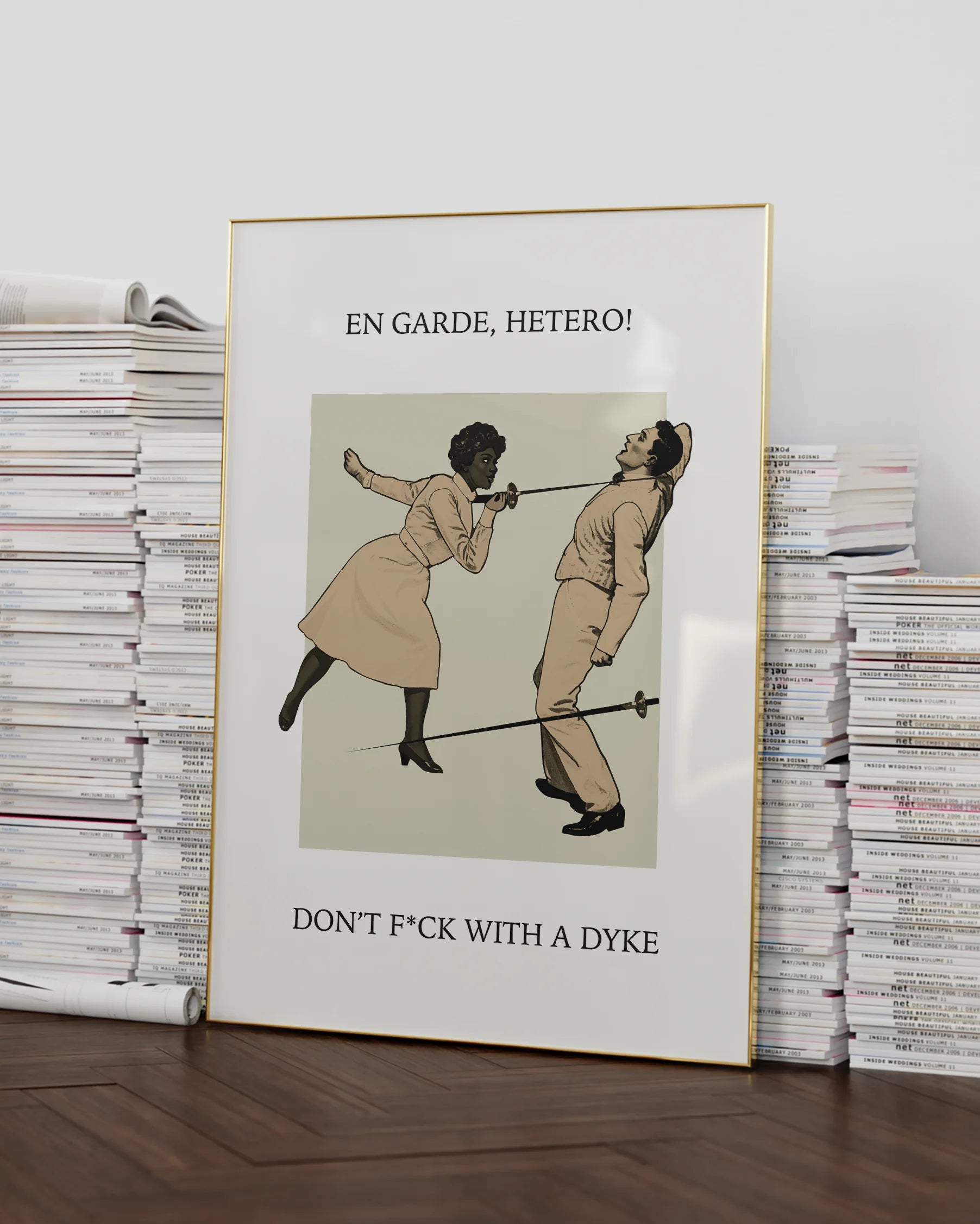 A poster with a woman fencing a man, with the text: "EN GARDE, HETERO! DON'T FUCK WITH A DYKE."