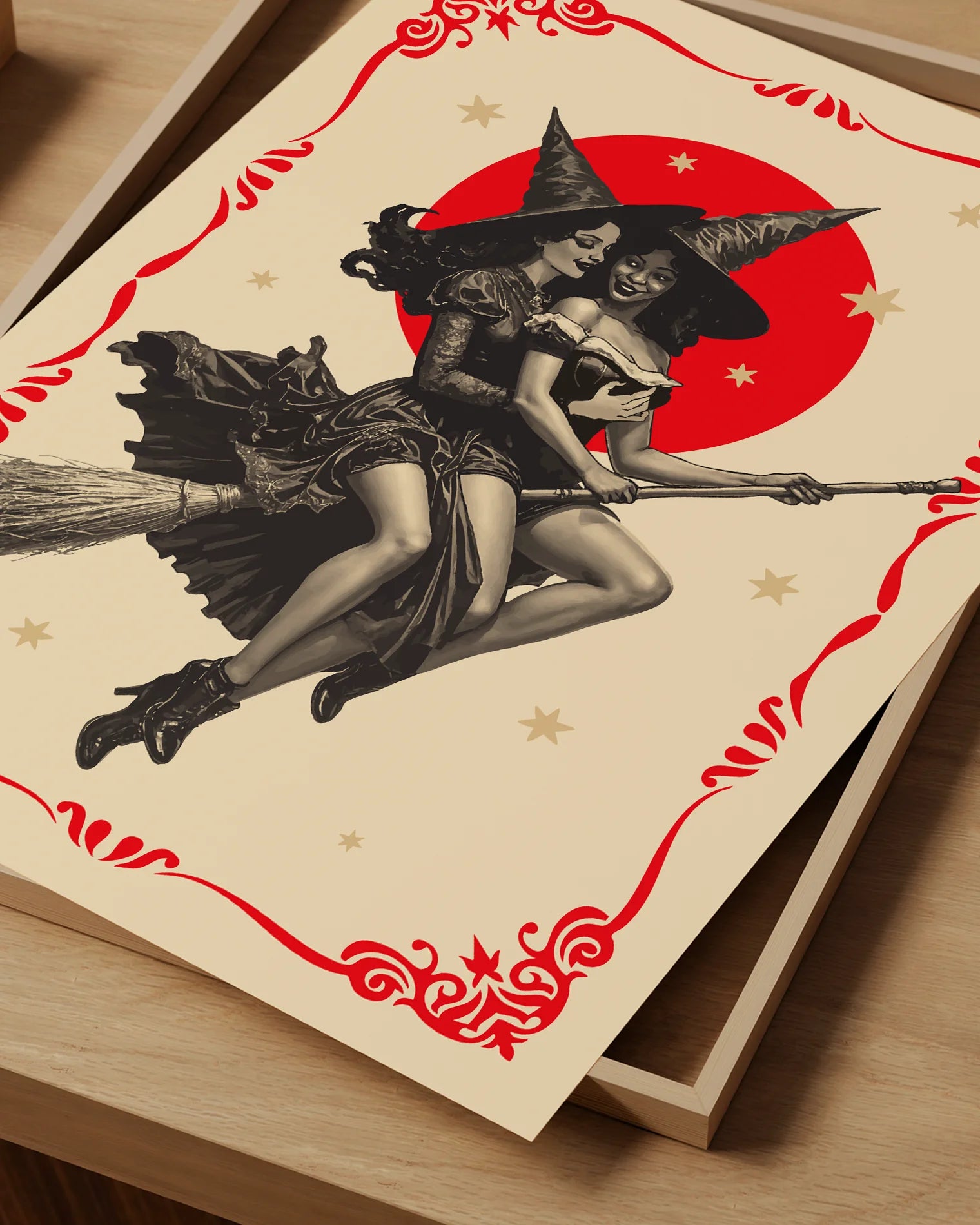 A poster featuring two lesbian witches flying on a broomstick through the night. They share a romantic gaze, surrounded by stars and a large red full moon.