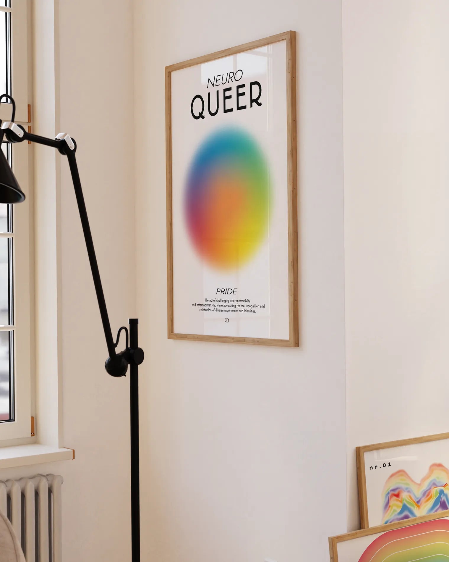 Framed, abstract poster with a circle in rainbow colours with a meaningful text about Neuro Queer and Pride.