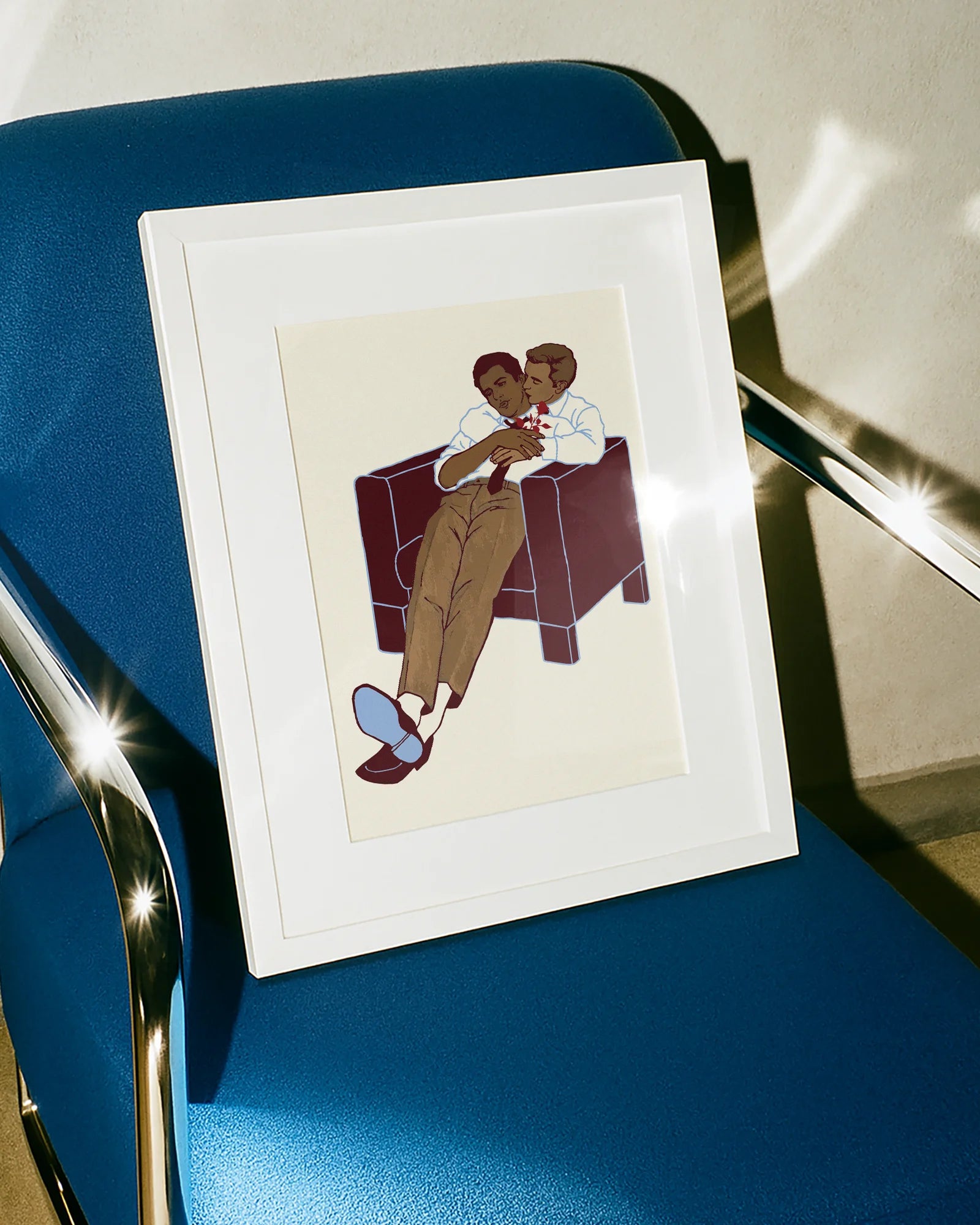 A framed poster with two gay men hugging.