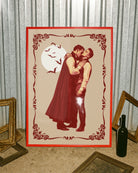 A poster featuring a male vampire kissing another man’s neck, framed by a vintage border, with a full moon and flying bats in the background.
