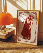 A poster featuring a male vampire kissing another man’s neck, framed by a vintage border, with a full moon and flying bats in the background.