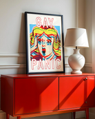 A framed poster featuring a screaming woman in pop art style with the text: *"GAY PANIC"* in red.
