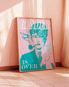 A poster featuring an androgynous person with one half of their face styled femininely and the other half masculinely, alongside the text: “GENDER IS OVER.”