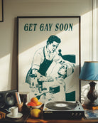 A poster depicting a male nurse taking care of a sick, bedridden man, accompanied by the ironic text: “GET GAY SOON.”