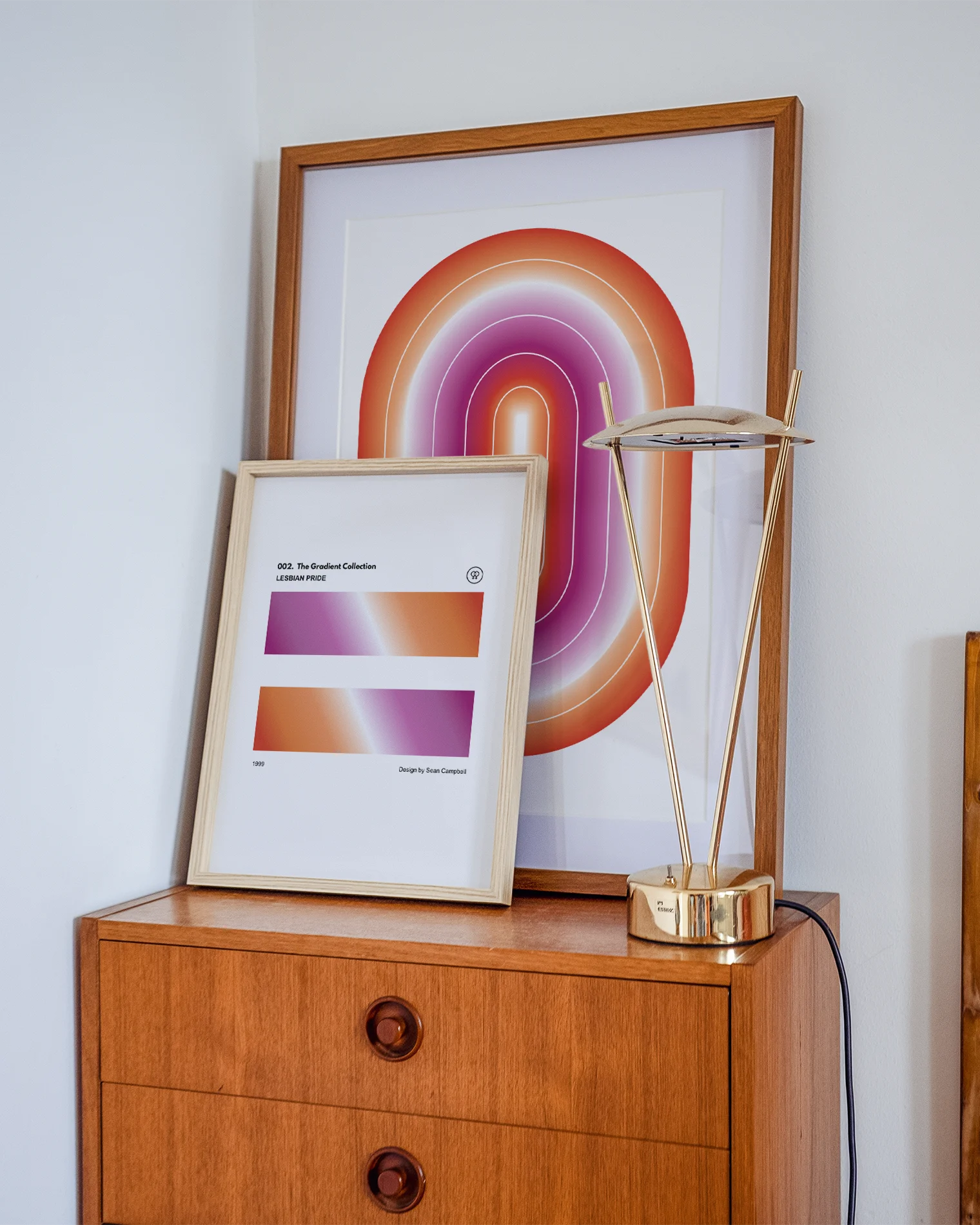 A print with two, rectangular, gradient blocks coloured with the lesbian pride flag colours, along the texts 'The Gradient Collection - Lesbian Pride'.