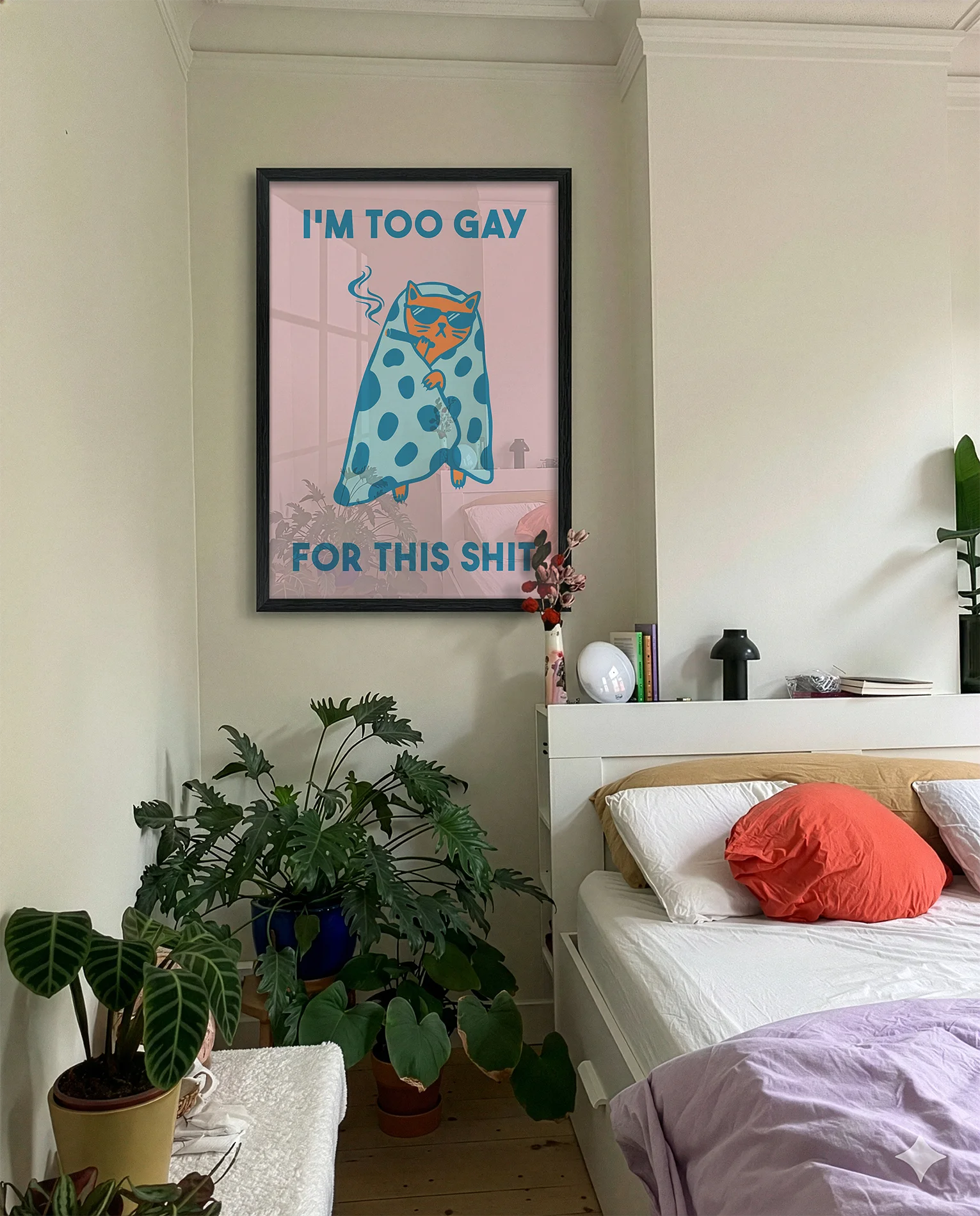 A framed poster with a cat wrapped in a blanket, smoking a cigarette with the text 'I'm too gay for this shit'.