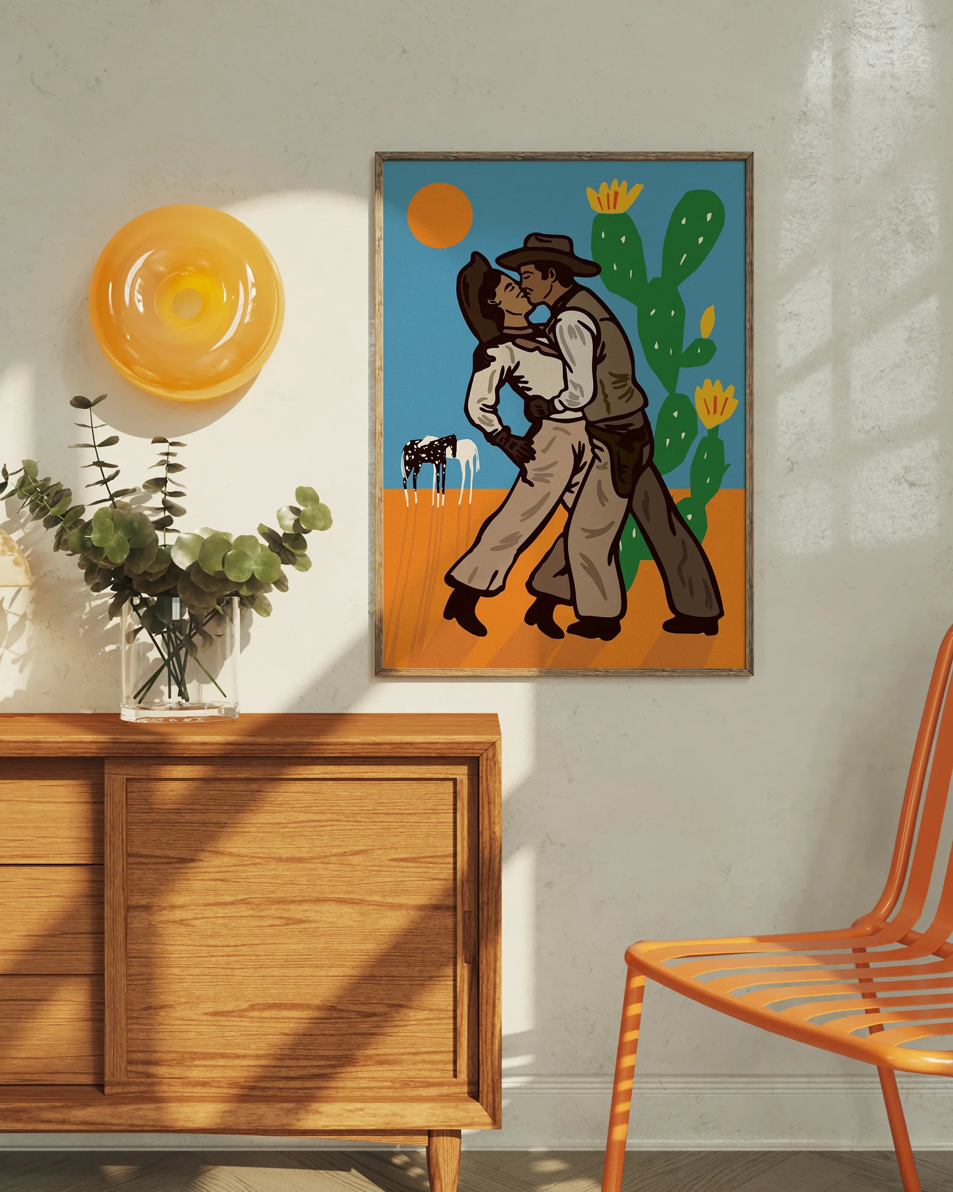 A print with two illustrated kissing cowboys in the wild west.