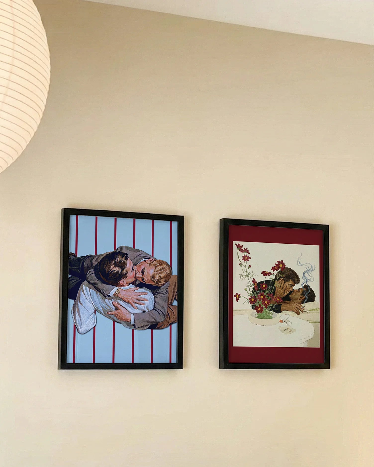 A framed print with a gay couple in the 1940's kissing on the floor. Vintage and retro style.