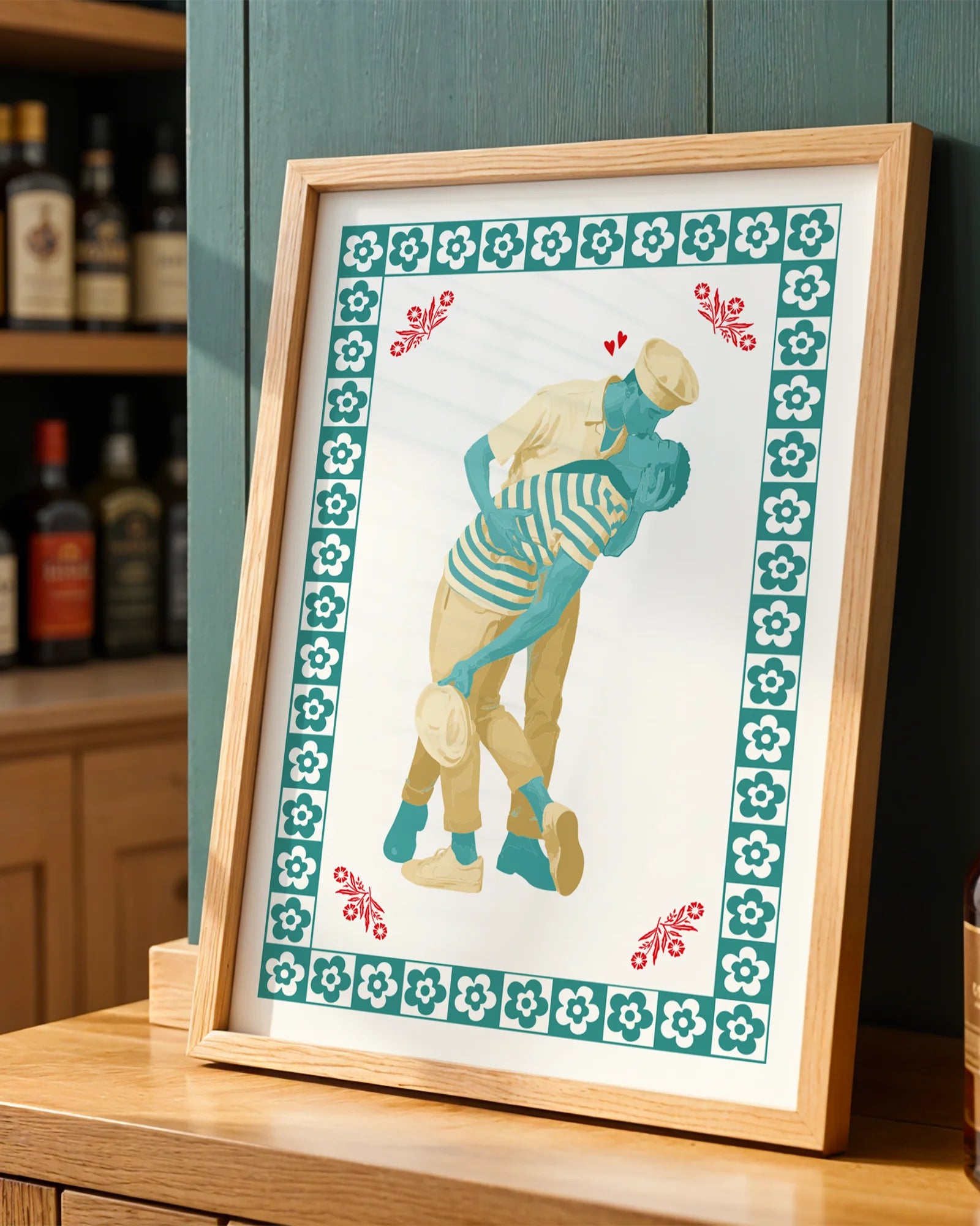 A poster featuring two gay sailor men locked in a passionate kiss, surrounded by a frame of soft flowers.