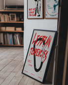 A print with an illustrated carabiner, with the text 'Lesbian Tendencies' in red.