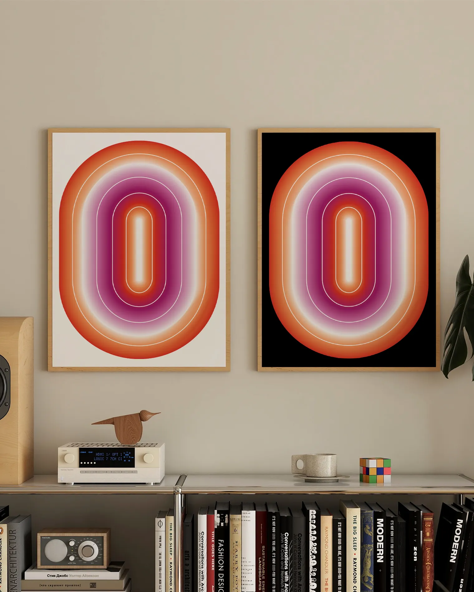 Two framed prints with a lesbian, illustrative flag in an oval form.