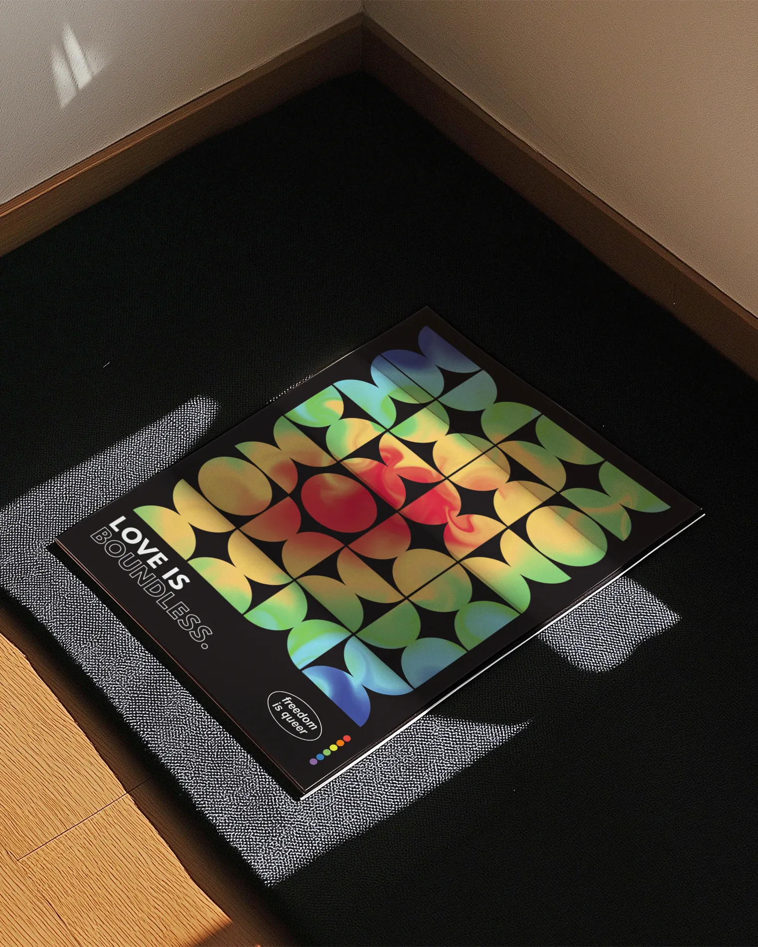 A print with the classic pride flag colours in abstract, rounded forms with the text 'Love Is Boundless.'