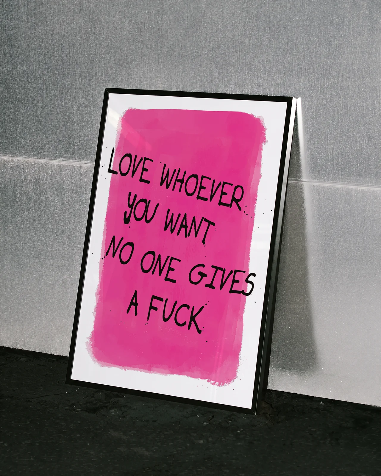A poster with a text 'Love whoever you want no one gives a fuck', against a pink background.