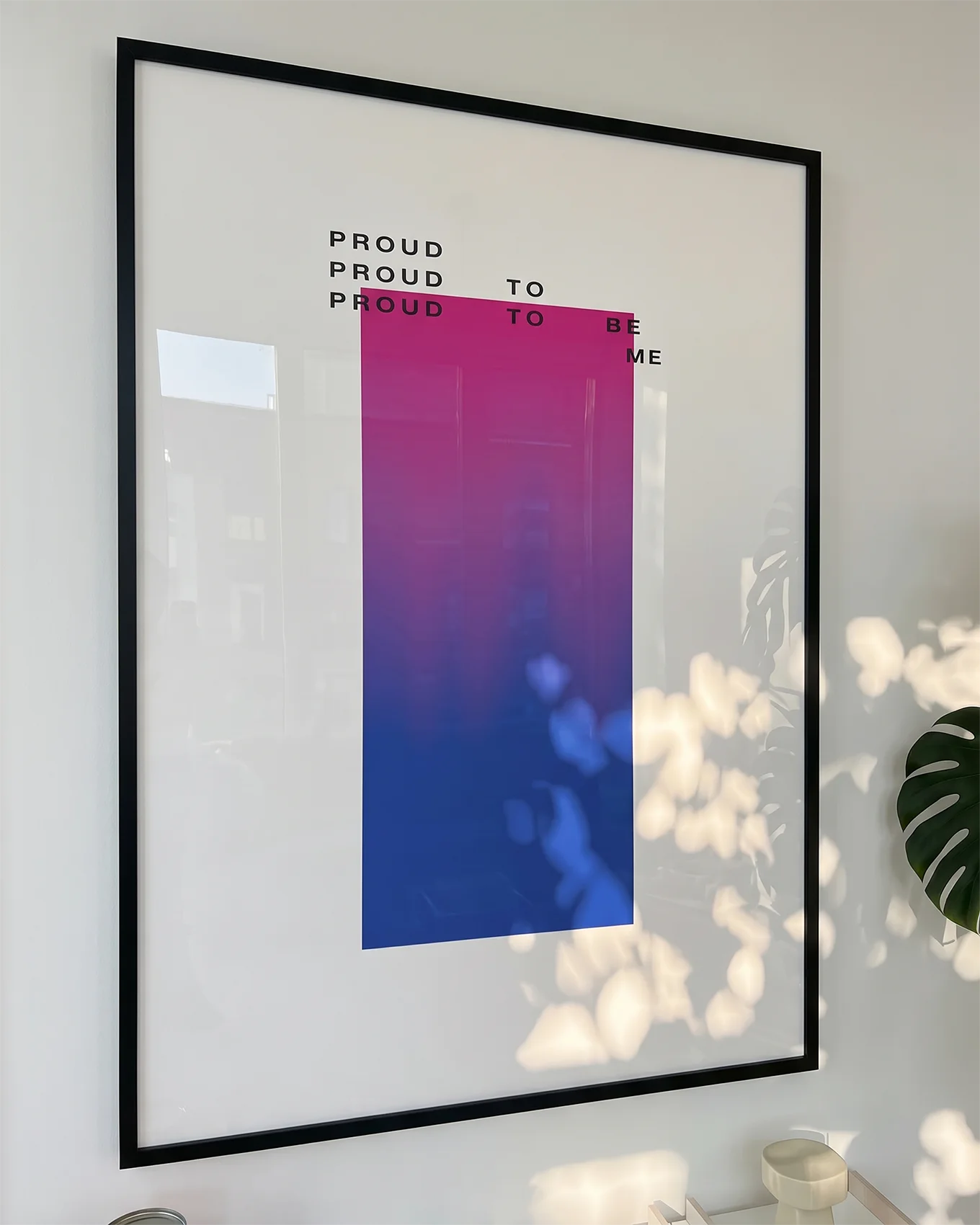 A poster with a gradient bisexual pride flag and the text: 'Proud to be me'.