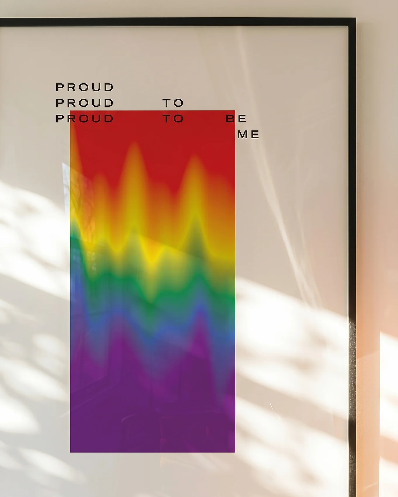 A poster with a gradient pride flag and the text: 'Proud to be me'.