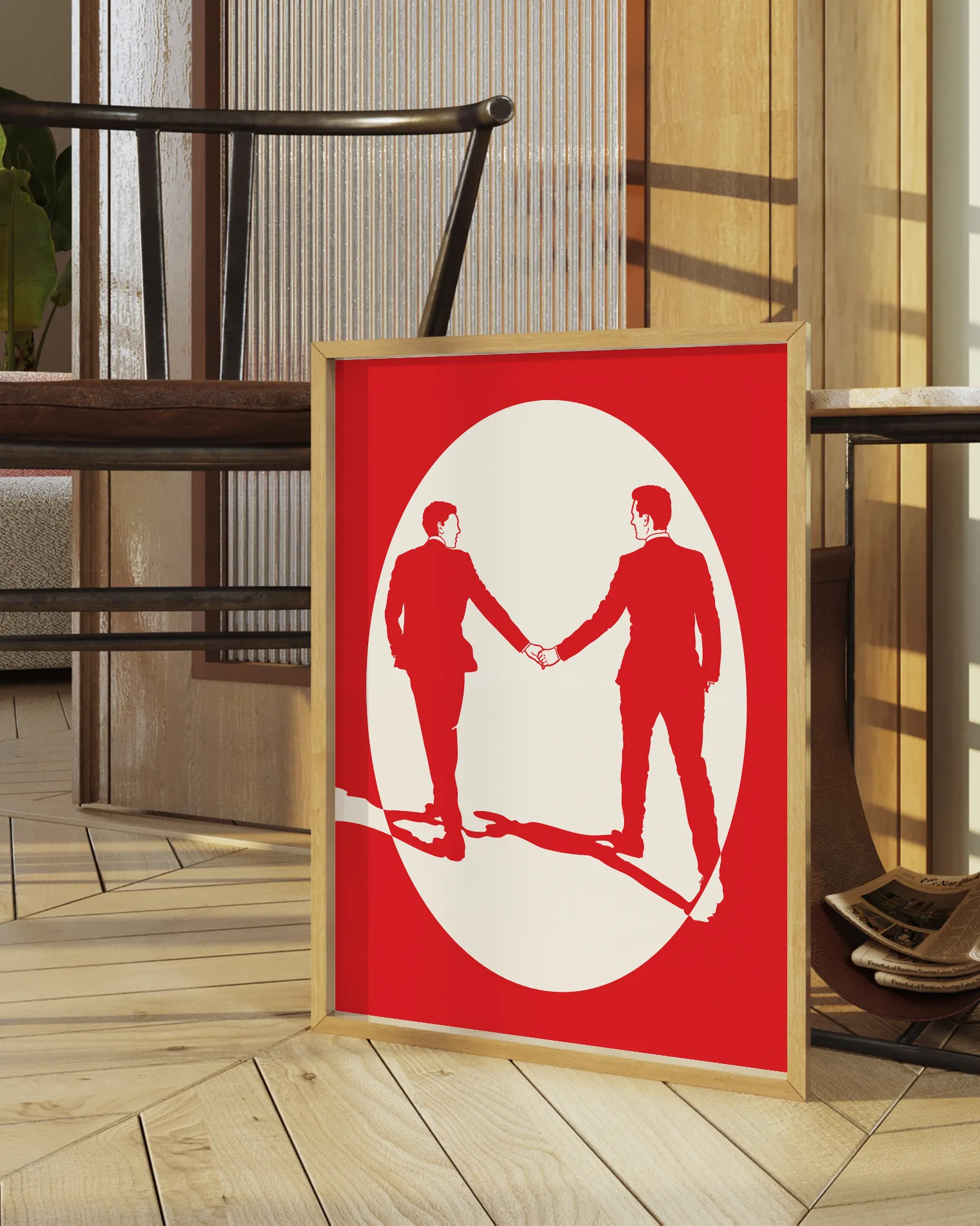 A print with an illustrated male couple in suits, walking hand in hand against a red background.