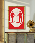 A print with an illustrated male couple in suits, walking hand in hand against a red background.