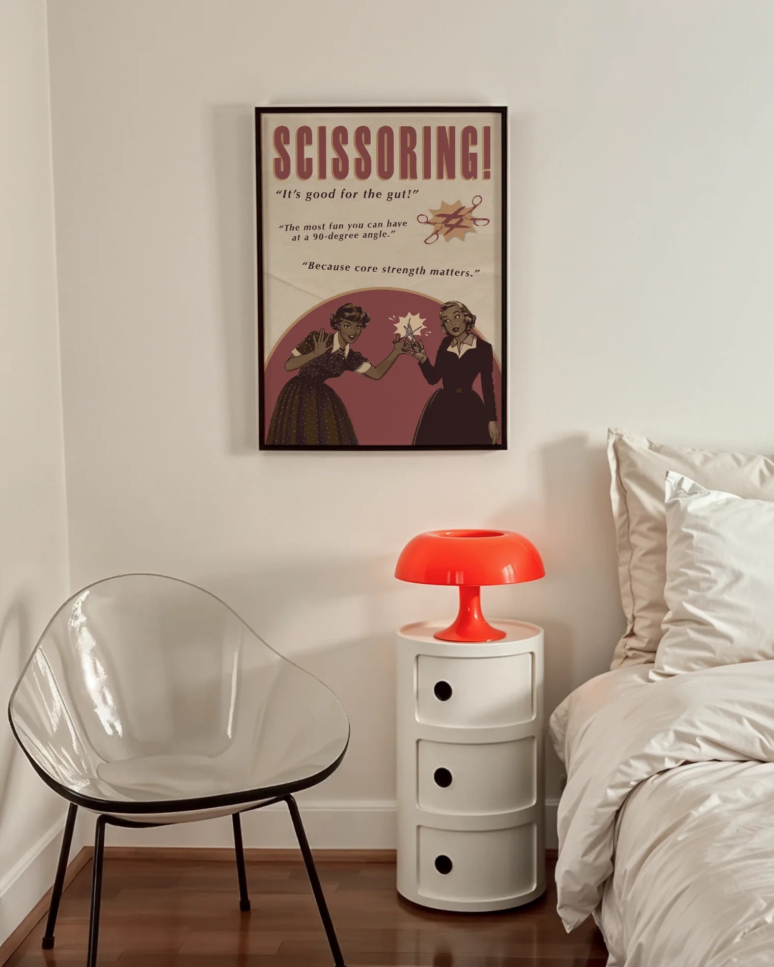 A print featuring two women playfully holding a pair of scissors toward each other, with the texts: “SCISSORING!”, “It’s good for the gut!”, “The most fun you can have at a 90-degree angle”, and “Because core strength matters.”