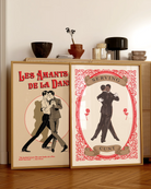 A poster with two illustrated gay men in the 60's, dancing together with the text 'Serving C*nt'.