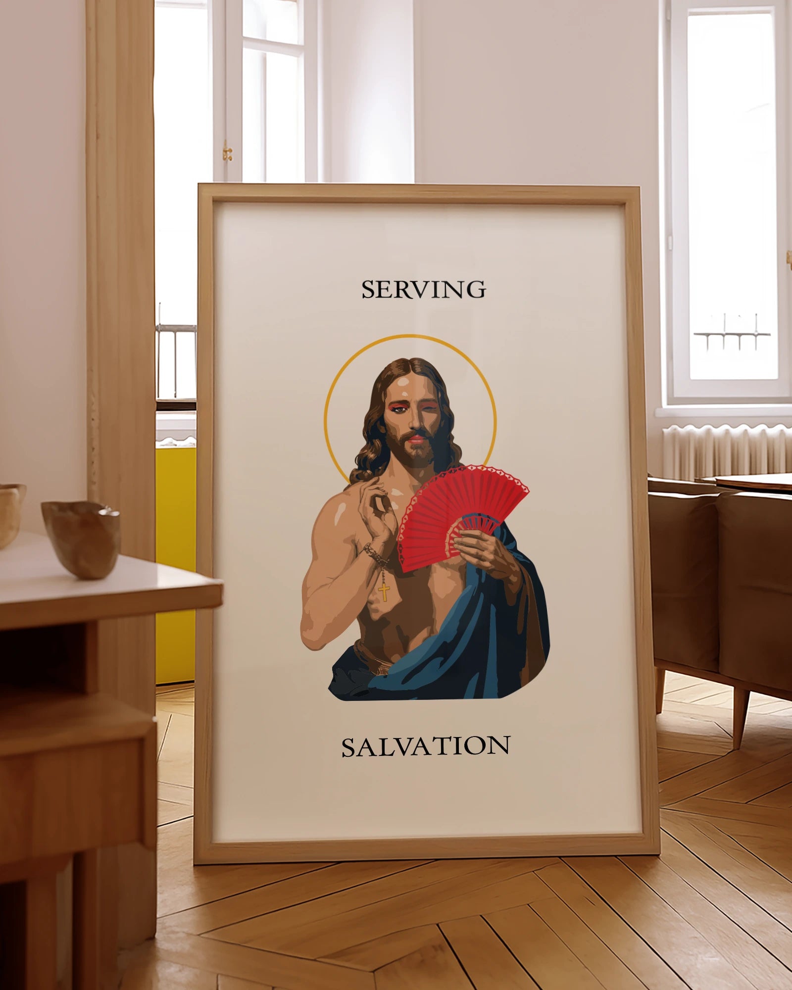 A poster with an illustrated Jesus in red makeup, holding a handfan with the text 'Serving Salvation'.