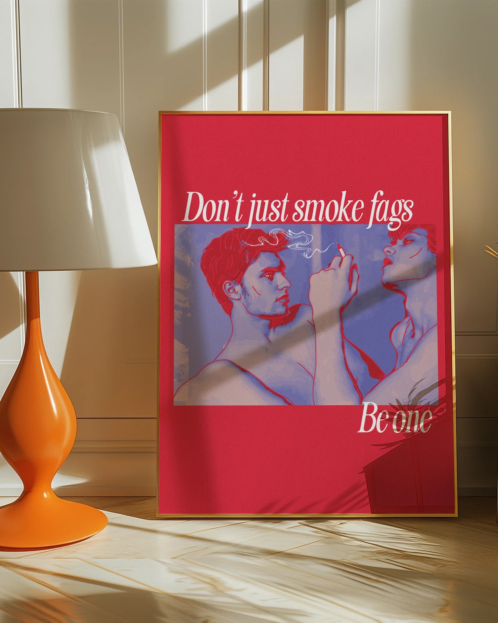 A framed poster shows two gay men, one of whom is smoking a cigarette, with the text: 'Don't just smoke fags — be one'.