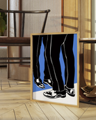 A print with two illustrated legs in suit pants standing in front of each other.