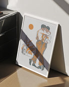 A framed poster depicting two gay men dancing in front of a burning church.