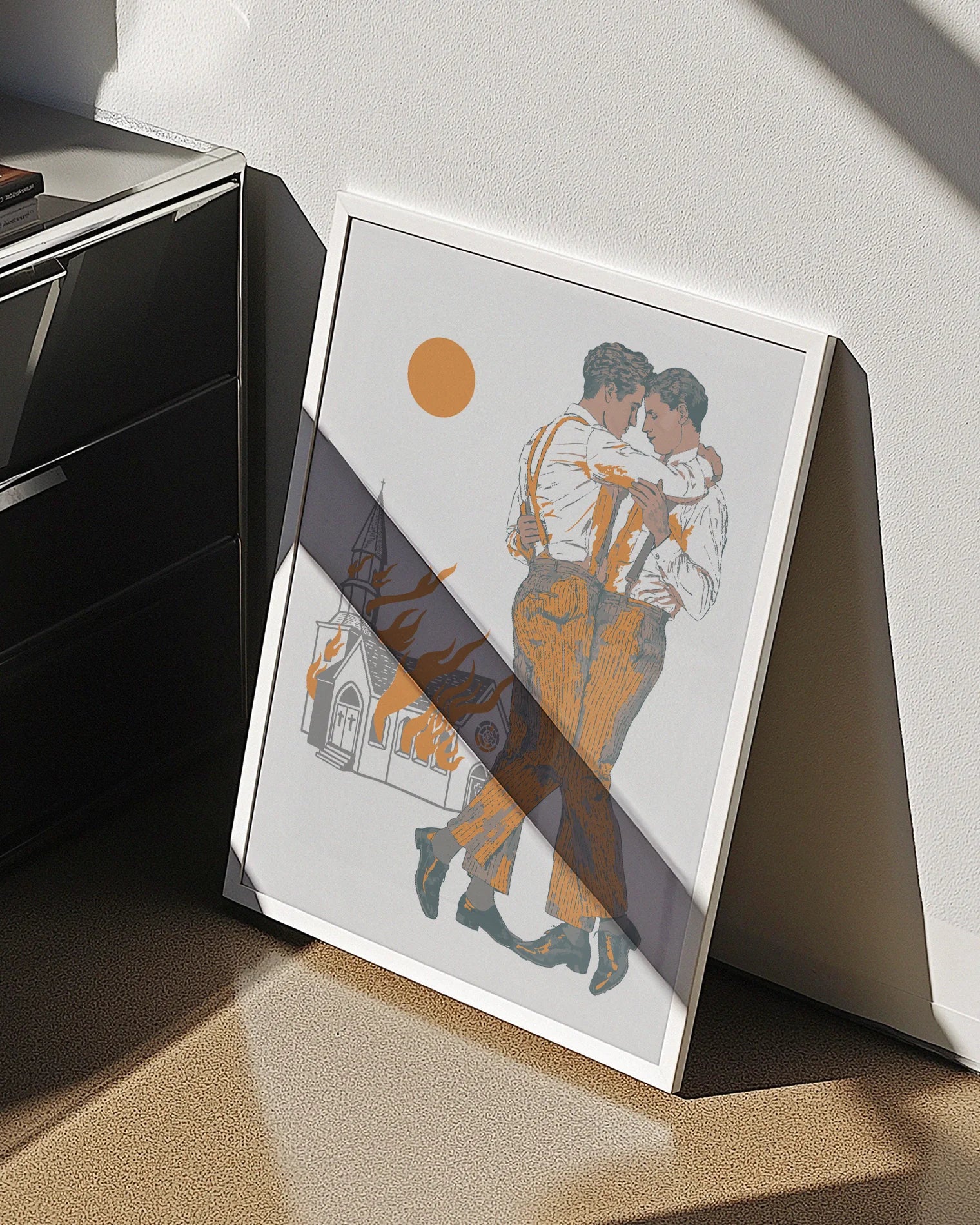 A framed poster depicting two gay men dancing in front of a burning church.