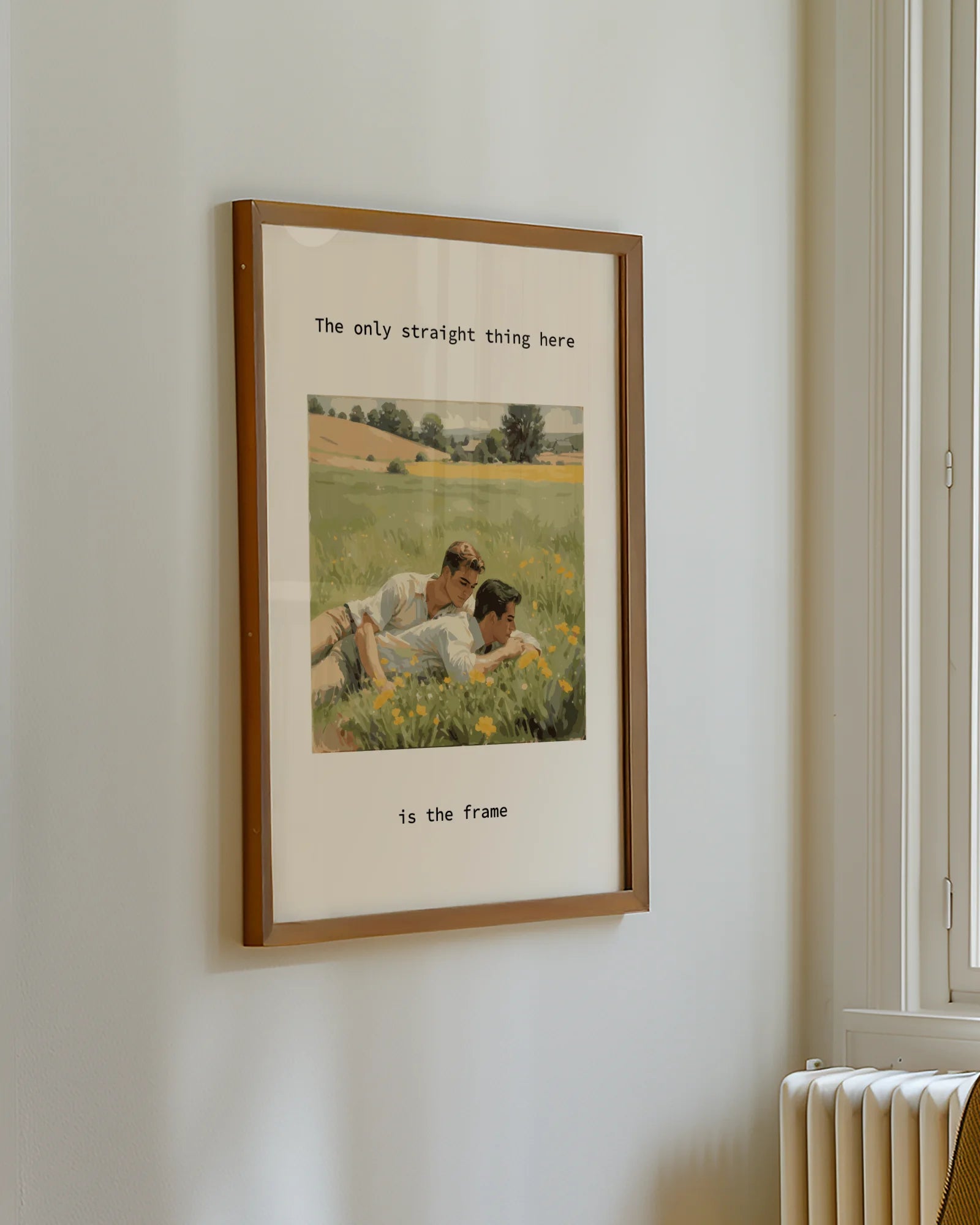 A poster with two gay men cuddling together in a summery green field of yellow flowers, with the text: “The only thing straight here is the frame.”