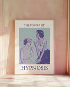 A poster with a woman staring unabashedly and fascinated at another woman’s chest, with the text: ‘THE POWER OF HYPNOSIS.