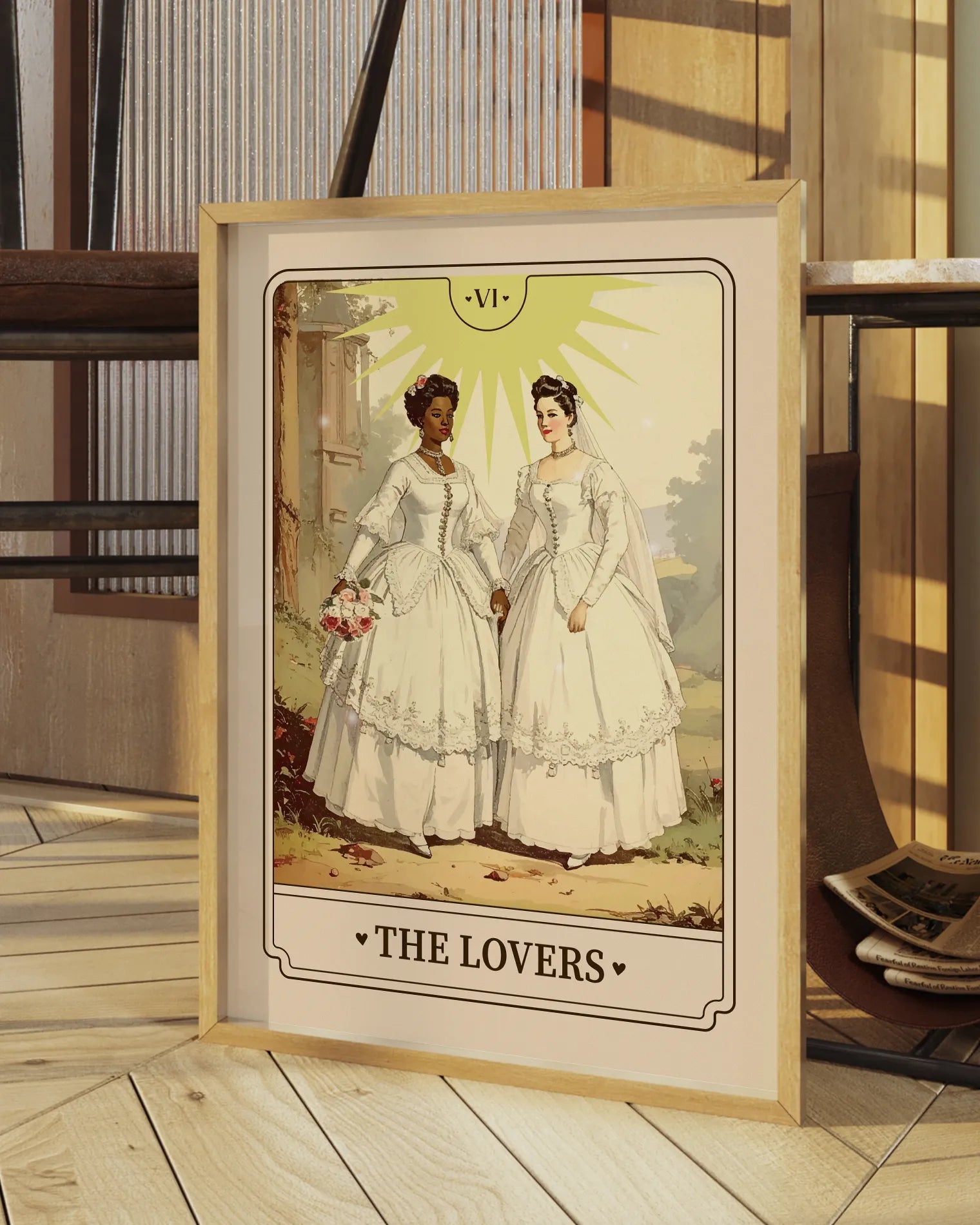 A print with an illustrated, sapphic, newlywed couple in a tarot card style with the text 'The Lovers'.