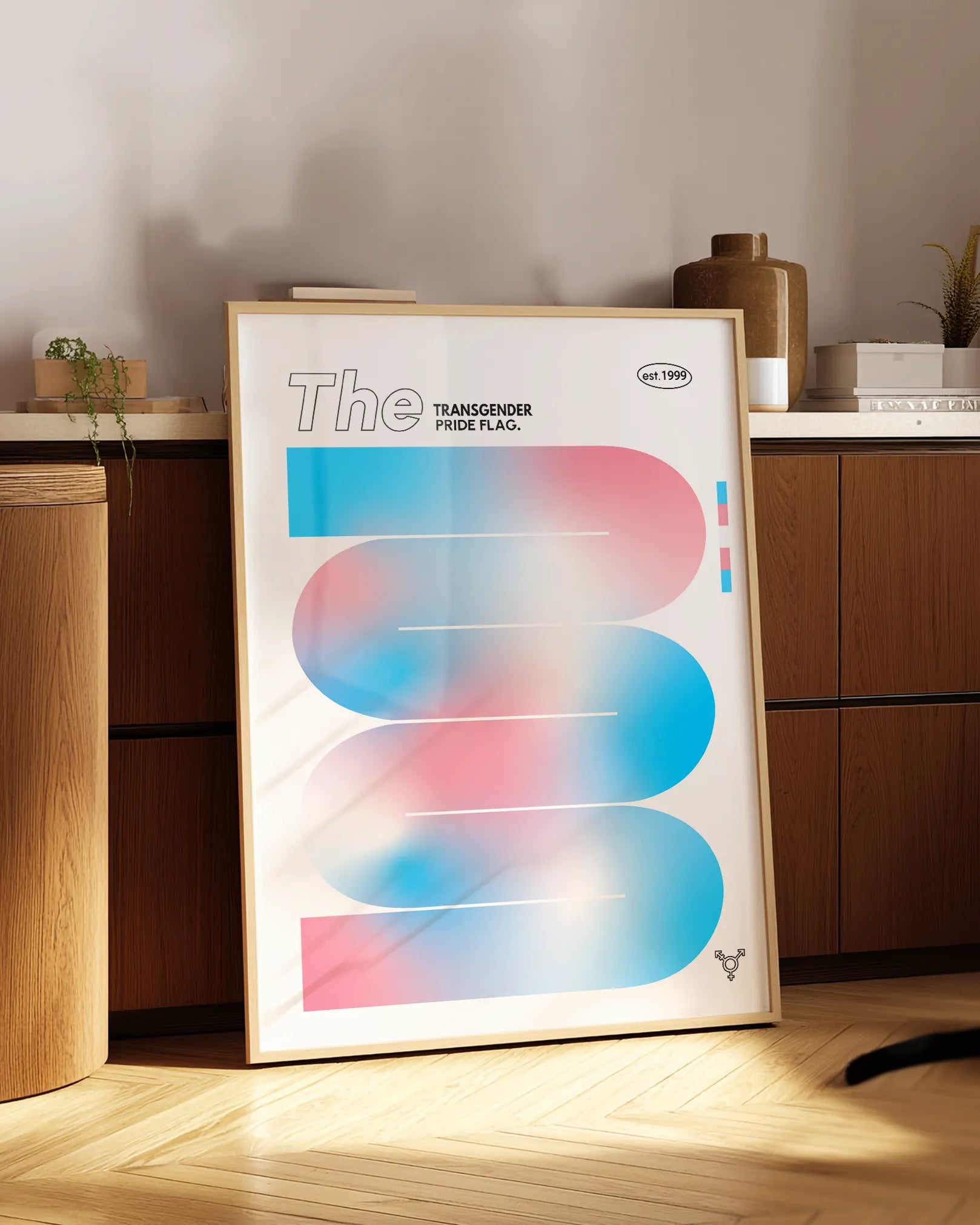 A print with the Transgender Pride Flag in a soft shape.