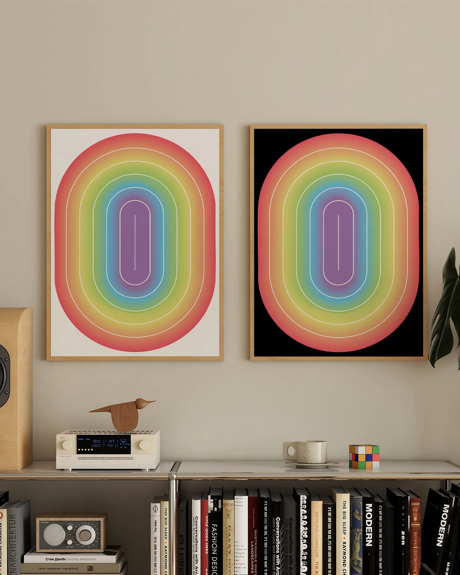 Two framed prints with an illustrative prideflag in an oval form.