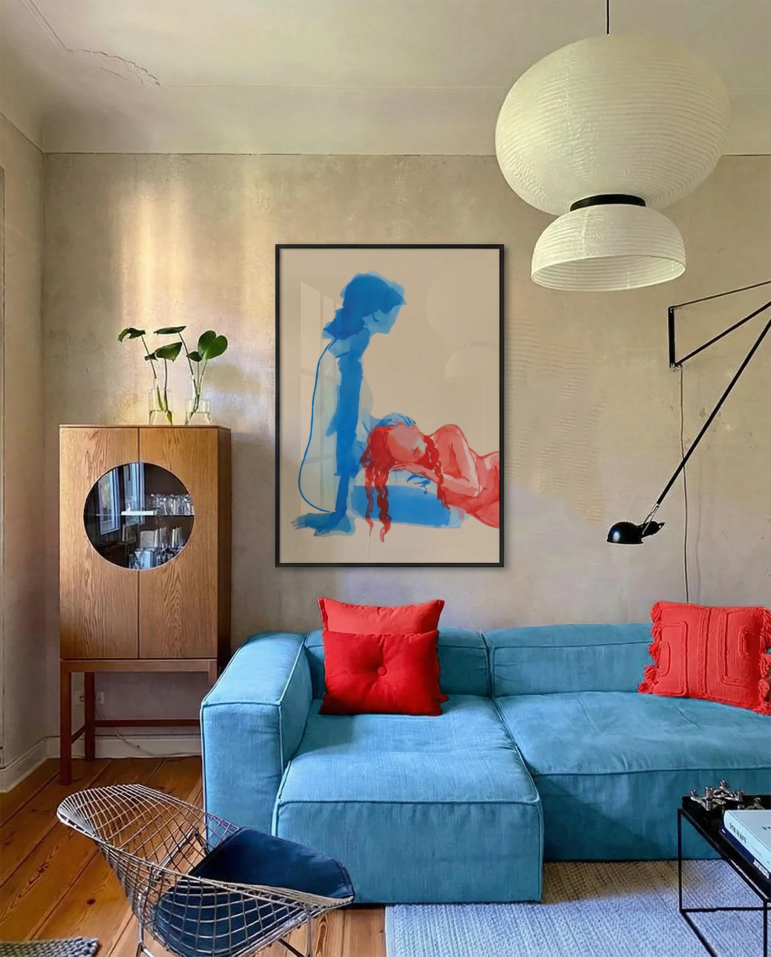 A framed print with two lesbian ladies on the beach, abstract.