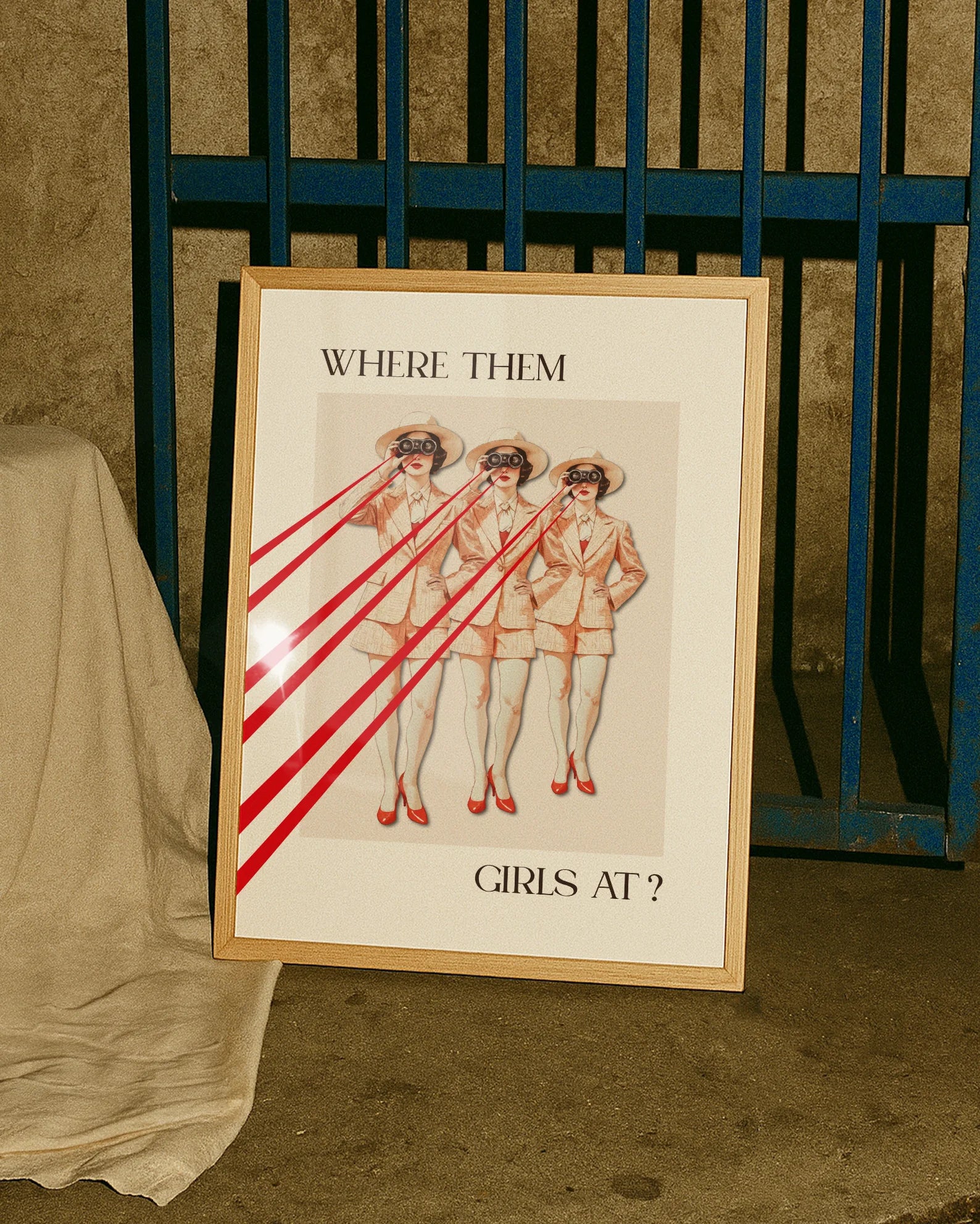 A poster with a woman, repeated three times, looking through a pair of binoculars with the text ‘WHERE THEM GIRLS AT?’.