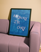 A poster with the text 'ANYWAY, I'M GAY' in pink, against a blue abstract background.