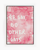 A framed poster with the text 'BE GAY, DO OTHER GAYS.', against a pink, abstract background.