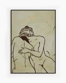 A framed print with two, naked woman holding each other in a green field.