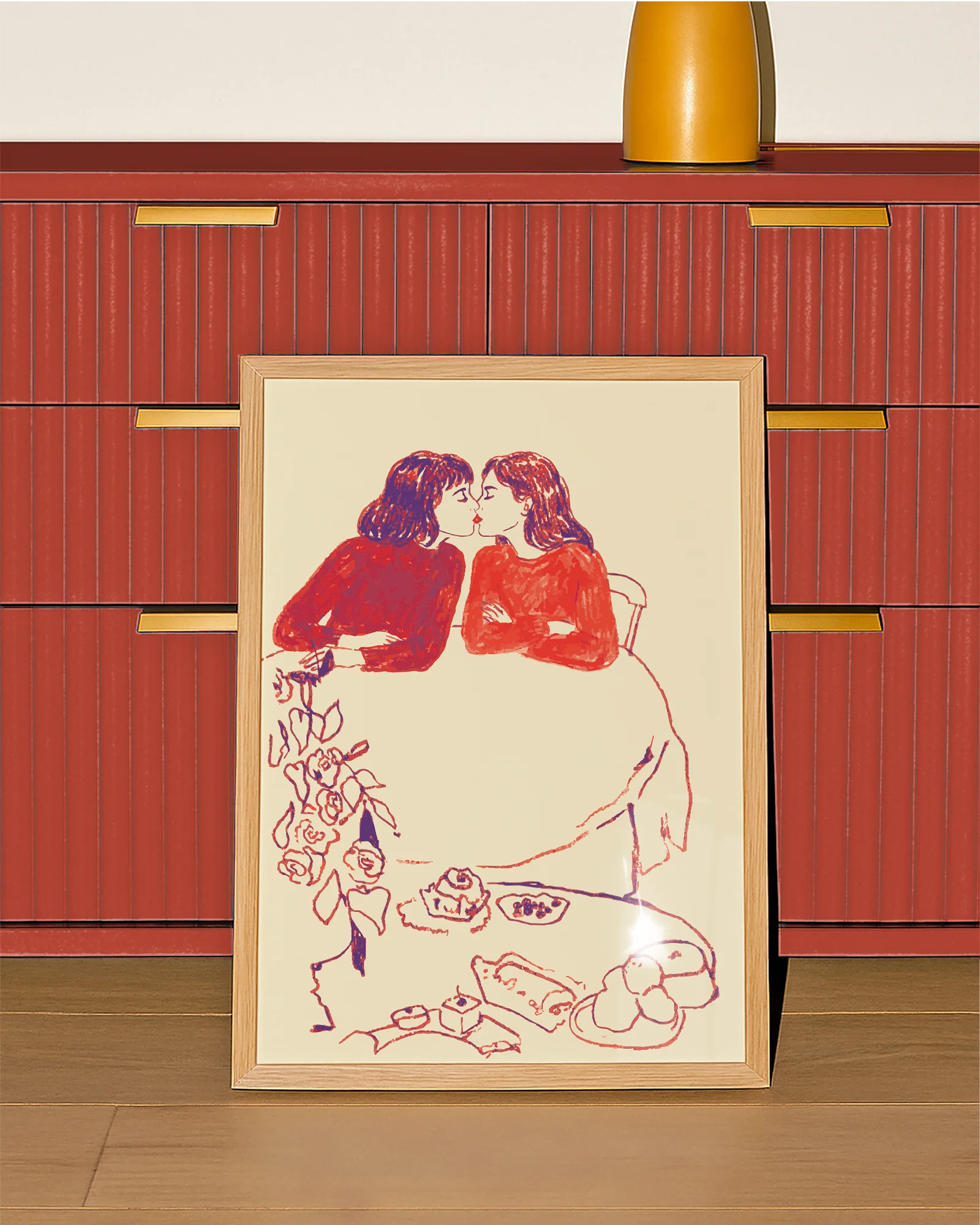 A framed poster with a sketched, lesbian cute couple kissing at a café.