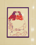 A framed poster with a sketched, lesbian cute couple kissing at a café.