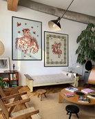 A poster with two lesbian cowgirls riding on a horse together.