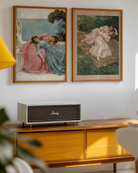 A framed poster with two sapphic ladies laying on each other in a park, victorian era, oil painting style.